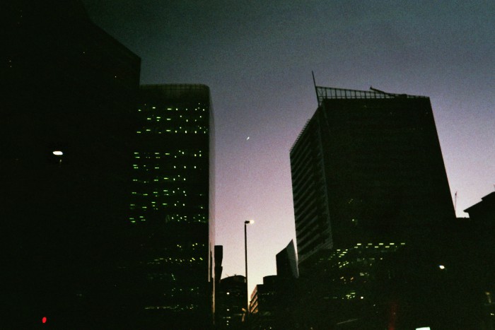 Sundown through the buildings of London.