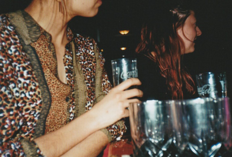 Stacking glasses with a tiger print shirt.