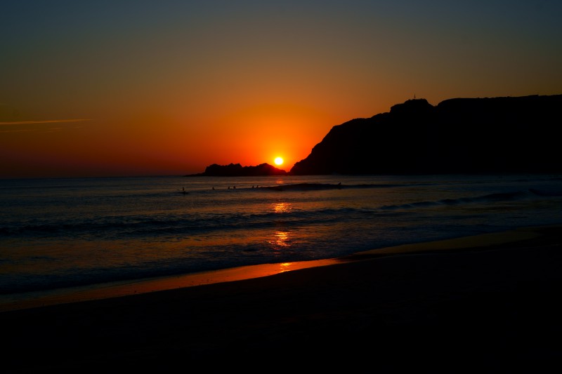 Sundown reflection on a beach.